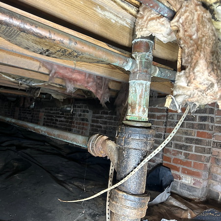 What are the early warning signs of a failing cast iron sewer line